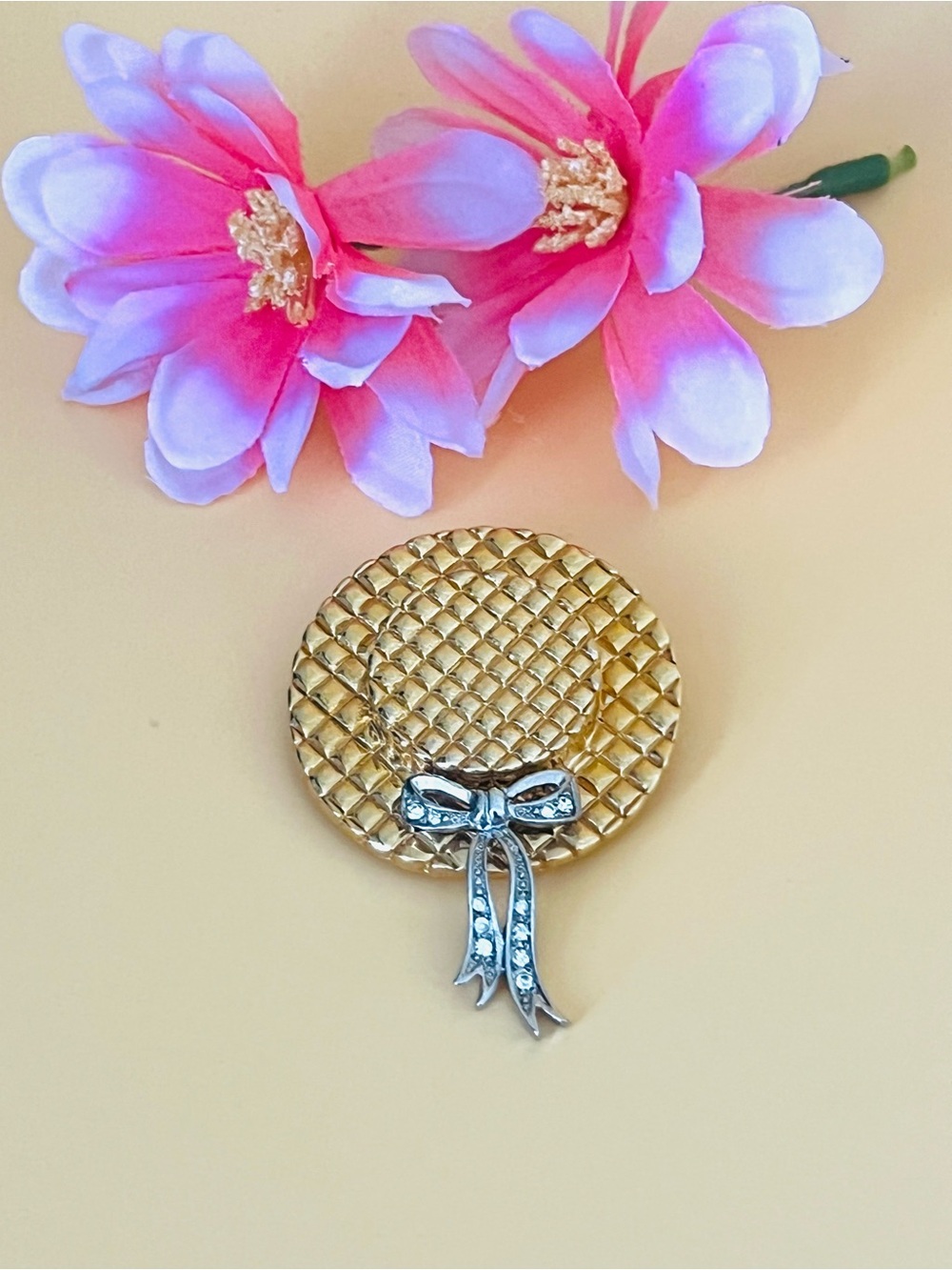 Elegant Gold and Silver hat with a Bow Brooch